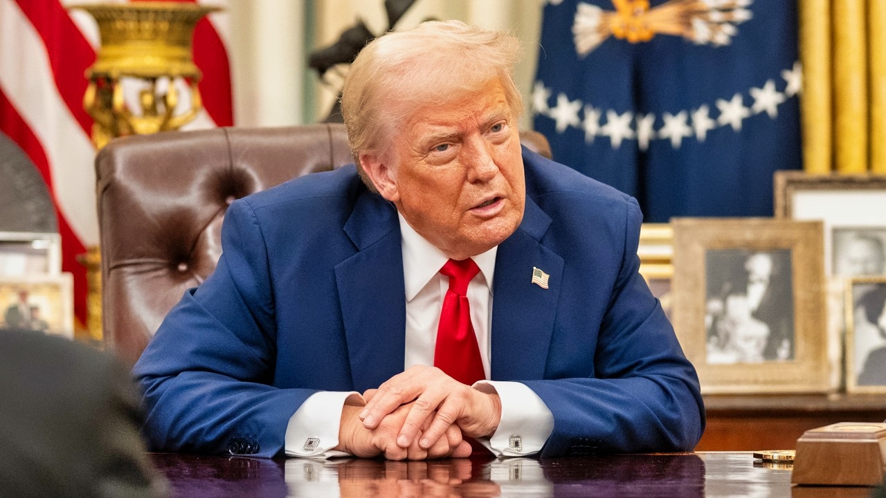 President Donald Trump signs an Executive Order alongside Kid Rock in the Oval Office, Monday, March 31, 2025. (Official White House Photo by Molly Riley)