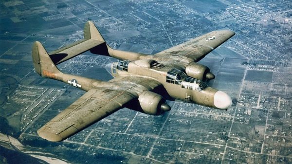 NORTHROP P-61 in flight. Northrop P-61 Black Widow night fighter had pilot, radar operator, and gunner.