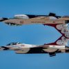 Two F-16 Fighting Falcon fighter jets assigned to the U.S. Air Force Air Demonstration Squadron “Thunderbirds” perform an aerial demonstration during the Aviation Nation 2022 airshow at Nellis Air Force Base, Nevada, Nov. 4, 2022. The Thunderbirds perform maneuvers that test and showcase what is required from every combat aviator. (U.S. Air Force photo by Airman 1st Class Josey Blades)