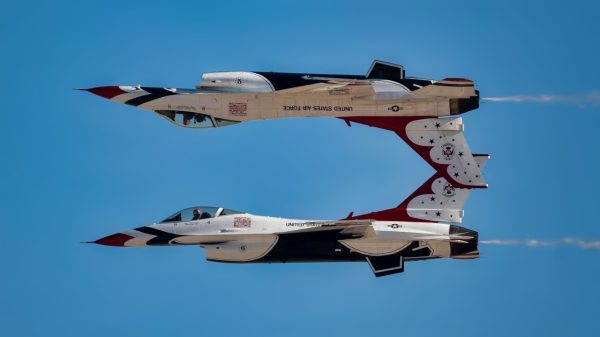 Two F-16 Fighting Falcon fighter jets assigned to the U.S. Air Force Air Demonstration Squadron “Thunderbirds” perform an aerial demonstration during the Aviation Nation 2022 airshow at Nellis Air Force Base, Nevada, Nov. 4, 2022. The Thunderbirds perform maneuvers that test and showcase what is required from every combat aviator. (U.S. Air Force photo by Airman 1st Class Josey Blades)