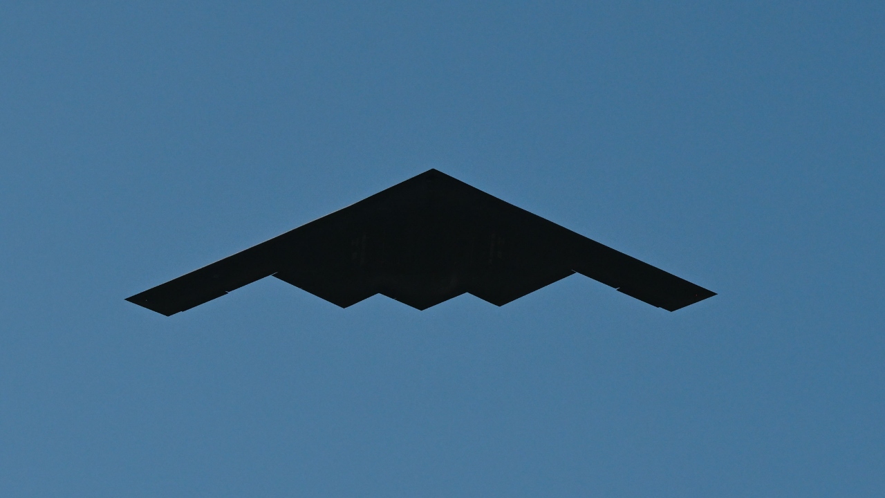 A U.S. Air Force B-2 Spirit, assigned to the 509th Bomb Wing, Whiteman Air Force Base, Mo., is flanked by two U.S. Air Force F-22 Raptors, assigned to the 1st Fighter Wing, Joint Base Langley-Eustis, Va., while conducting a flyover over the White House in Washington, D.C., July 4, 2025. The B-2 provides penetrating flexibility and effectiveness inherent in manned bombers. (U.S. Air Force photo by Airman 1st Class Geneva Nguyen)