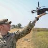 U.S. Army Spc. Harry Santiago IV, assigned to the Multi-Functional Reconnaissance Company, 2nd Brigade Combat Team, 101st Airborne Division (Air Assault), launches a Skydio X2D drone on Mihail Kogalniceanu Air Base, Romania, July 09, 2025. V Corps provides essential support to multinational training and exercises of robust and evolving complexity, scope, scale, rigor, and operational conditions and provides targeted security force assistance alongside national and multinational corps and divisions. (U.S. Army photo by Spc. Breanna Bradford)