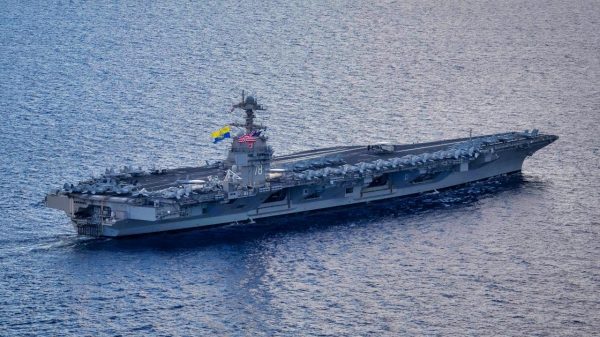 The world's largest aircraft carrier USS Gerald R. Ford (CVN 78) sails in the Mediterranean Sea, Dec. 31, 2023. The U.S. maintains forward deployed, ready, and postured forces to deter aggression and support security and stability around the world. (U.S. Navy photo by Mass Communication Specialist 2nd Class Jacob Mattingly)