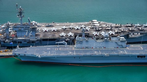 (July 7, 2022) – U.S. Navy nuclear-powered aircraft carrier USS Abraham Lincoln (CVN72) and Republic of Korea Navy amphibious assault ship ROKS Marado (LPH 6112) moored at Joint Base Pearl Harbor-Hickham, Hawaii, during Rim of the Pacific (RIMPAC) 2022. Twenty-six nations, 38 ships, four submarines, more than 170 aircraft and 25,000 personnel are participating in RIMPAC from June 29 to Aug 4 in and around Hawaiian Islands and Southern California. The world’s largest international maritime exercise, RIMPAC provides a unique training opportunity while fostering and sustaining cooperative relationships among participants critical to ensuring the safety of sea lanes and security on the world’s oceans. RIMPAC 2022 is the 28th exercise in the series that began in 1971. (U.S. Navy photo by Mass Communication Specialist Seaman Leon Vonguyen)
