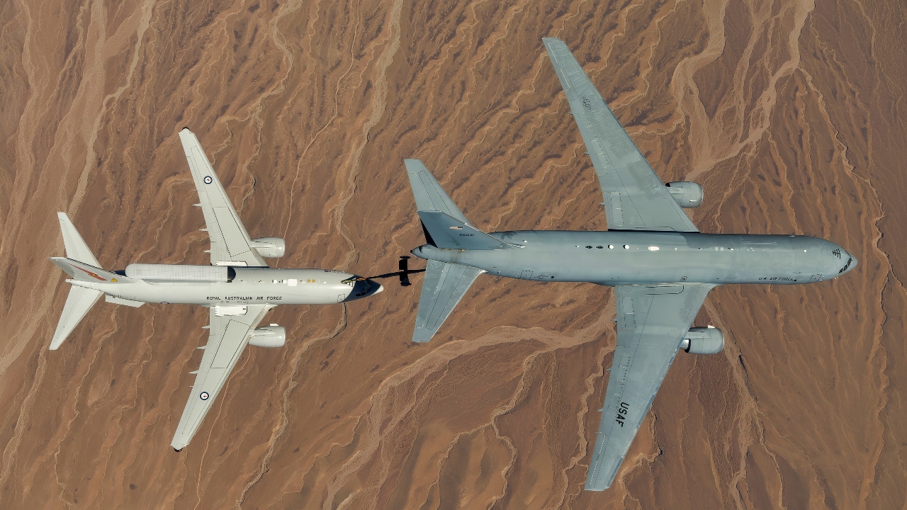 A KC-46A assigned to the 418th Flight Test Squadron at Edwards Air Force Base positions to refuel a Royal Australian Air Force E-7A Wedgetail in the airspace near Edwards. Aircrews from the USAF, RAAF, and Royal Air Force worked together to rapidly certify this enhanced combat capability for the RAAF E-7A fleet. The trilateral test also allowed the United Kingdom and United States Air Force to gain early test experience ahead of their anticipated fielding of E-7 aircraft variants. (Air Force photo by Richard Gonzales)