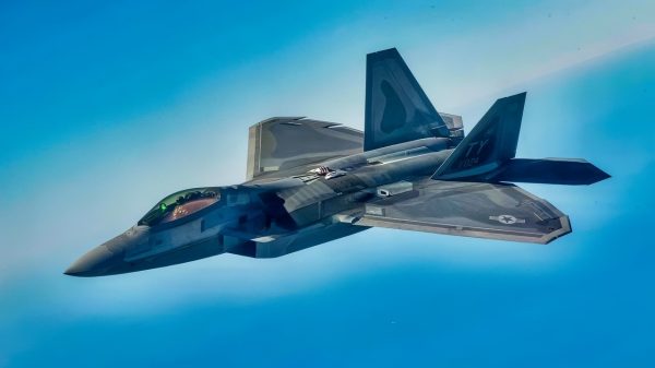 A U.S. Air Force KC-135 Stratotanker with the 434th Air Refueling Wing, Indiana, which had an aircrew with the 63rd Air Refueling Squadron, Florida, refuels a F-22 Raptor with the 325th Fighter Wing, Florida on February 23, 2021. The Stratotanker was on loan to MacDill Air Force Base. (U.S. Air Force photo by Senior Airman Tiffany A. Emery)