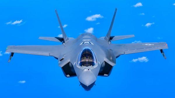 Six F-35 Lightning ii aircraft follow closely behind a KC-135 stratotanker aircraft during a trip across the pacific ocean, April 20, 2025. The KC-135 provided aerial refueling support, enabling the six F-35s to reach Guam and Japan for a military exercise. (U.S. Air National Guard photo by Tech. Sgt. Andrew Stover)