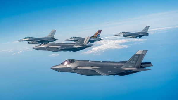 A formation of U.S. Air Force F-35 Lighting IIs and F-16 Fighting Falcons assigned to the 48th and 31st Fighter Wings respectively fly in formation as a part of Exercise Combined Strike along the coast of Italy, August 18, 2025. Exercises like Combined Strike ensure USAFE remains ready and postured to rely on one another to defend the area of responsibility. (U.S. Air Force photo by Senior Airman Zachary Jakel)