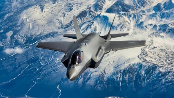 A new F-35A Lightning II fifth-generation fighter aircraft flies over the Alaska Canada Highway en route to its new home at the 354th Fighter Wing, Eielson Air Force Base, Alaska, April 21, 2020. The F-35 represents a new model of international cooperation, ensuring U.S. and Coalition partner security well into the 21st Century. (U.S. Air National Guard photo by Tech. Sgt. Adam Keele)