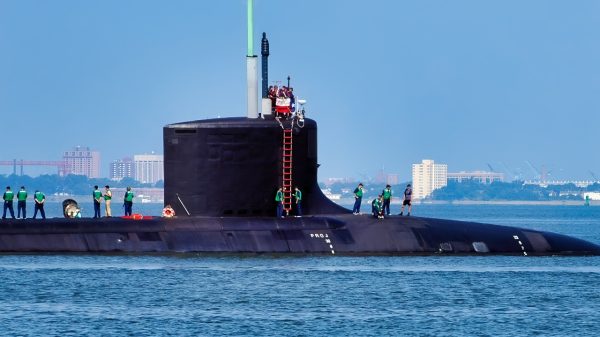 Norfolk, Va. (Aug. 22, 2006) – Sailors stationed aboard the Pre Commissioning Unit (PCU) Texas (SSN 775) stand topside as she gets underway from Naval Station Norfolk.