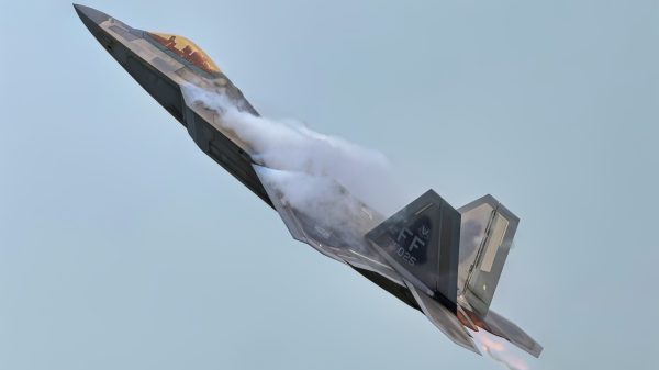 An F-22 Raptor creates vapor trails during a high-speed maneuver during a training flight at Joint Base Langley-Eustis, Virginia, June 13, 2025. The aircraft’s design allows it to remain highly maneuverable while maintaining low observability. (U.S. Air Force photo by Senior Airman Adisen Smith)