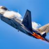 Afterburners are lit as an F-22 Raptor performs an aerial demonstration at the New York Air Show at Montgomery, New York, Aug. 23, 2025. The rapid change in angle of attack causes visible vapor to form around the aircraft, giving spectators a clear view of the jet’s aerodynamic performance. This demonstration highlights the unique thrust-vectoring capabilities of the F-22, allowing it to achieve extreme agility unmatched by other fighter aircraft. (U.S. Air Force photo by Staff Sgt. Lauren Cobin)