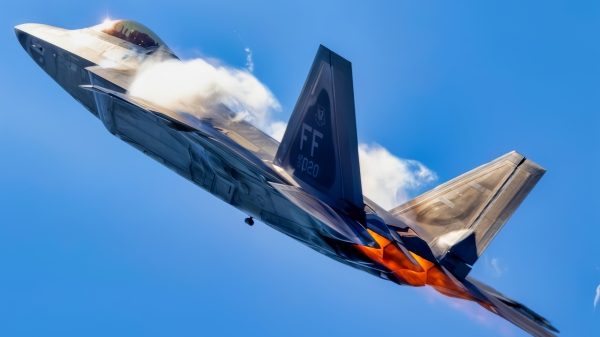 Afterburners are lit as an F-22 Raptor performs an aerial demonstration at the New York Air Show at Montgomery, New York, Aug. 23, 2025. The rapid change in angle of attack causes visible vapor to form around the aircraft, giving spectators a clear view of the jet’s aerodynamic performance. This demonstration highlights the unique thrust-vectoring capabilities of the F-22, allowing it to achieve extreme agility unmatched by other fighter aircraft. (U.S. Air Force photo by Staff Sgt. Lauren Cobin)