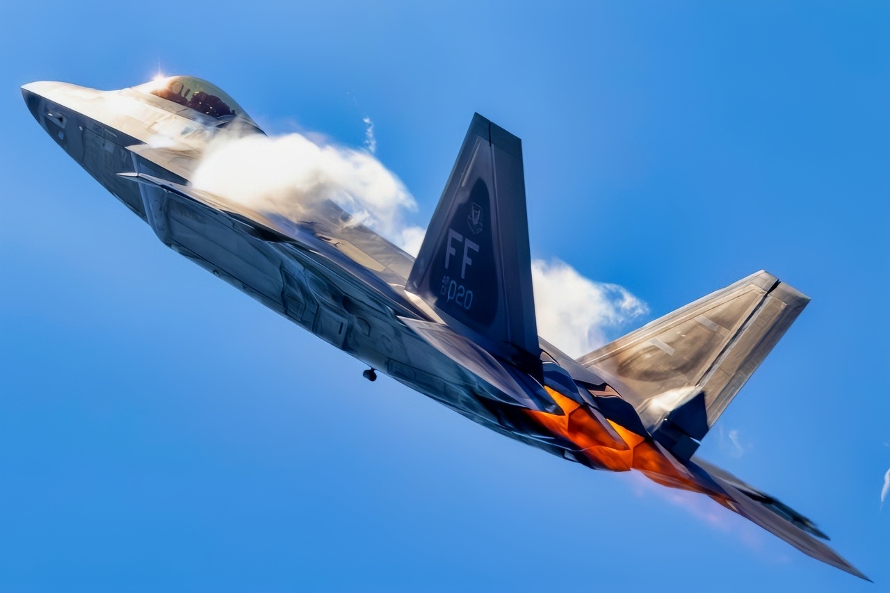 Afterburners are lit as an F-22 Raptor performs an aerial demonstration at the New York Air Show at Montgomery, New York, Aug. 23, 2025. The rapid change in angle of attack causes visible vapor to form around the aircraft, giving spectators a clear view of the jet’s aerodynamic performance. This demonstration highlights the unique thrust-vectoring capabilities of the F-22, allowing it to achieve extreme agility unmatched by other fighter aircraft. (U.S. Air Force photo by Staff Sgt. Lauren Cobin)