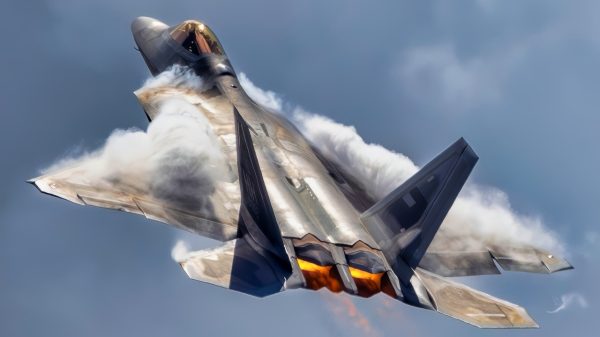 An F-22 Raptor performs an aerial demonstration at Marine Corps Air Station Kaneohe Bay, Hawaii, Aug. 8, 2025. The rapid change in angle of attack causes visible vapor to form around the aircraft, giving spectators a clear view of the jet’s aerodynamic performance. This demonstration highlights the unique thrust-vectoring capabilities of the F-22, allowing it to achieve extreme agility unmatched by other fighter aircraft. (U.S. Air Force photo by Staff Sgt. Lauren Cobin).