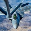 An F-22 Raptor approaches to receive fuel from a KC-135 Stratotanker assigned to the 92nd Air Refueling Wing during the Weapons Integration course over the Nevada Test and Training Range, Dec. 12, 2023. Air refueling crews assigned to the 92nd, 93rd and 97th Air Refueling Squadrons at Fairchild Air Force Base, Washington, participated in the WSINT course to enhance interoperability with a variety of aircraft and demonstrate how Air Mobility Command’s air refueling capabilities enhance global reach for all Department of Defense air operations. WSINT is a series of complex, large-force employment missions that serve as the capstone portion of Weapons School classes, which take place twice a year at Nellis Air Force Base, Nevada. WSINT students plan and execute every aspect of air, space and cyber combat operations, with joint force components converging over the Nevada Test and Training Range. (U.S. Air Force photo by Senior Airman Haiden Morris)