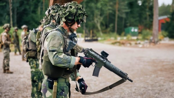 A Swedish Marine with the 2nd Amphibious Battalion, 1st Marine Regiment reloads an Automatkarbin 5 service rifle during a live fire range as part of exercise Archipelago Endeavor 25 in Berga, Sweden, Aug. 28, 2025. Exercise Archipelago Endeavor 25 increases compatible interoperability between the U.S. Marine Corps and Swedish Amphibious Forces by executing combined amphibious operations in and around the Baltic Sea littorals. (U.S. Marine Corps photo by Lance Cpl. Frank Sepulveda Torres)