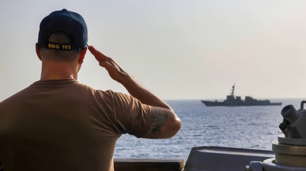 U.S. CENTRAL COMMAND AREA OF RESPONSIBILITY (Aug. 25, 2025) The executive officer of the Arleigh Burke-class guided-missile destroyer USS Truxtun (DDG 103) renders honors to the USS Forrest Sherman (DDG-98) aboard the USS Truxtun, in the U.S. Central Command area of responsibility. (Official U.S. Navy photo)