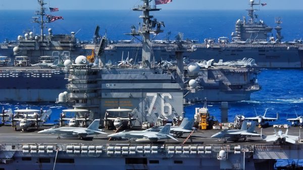 USS Ronald Reagan (CVN 76), USS Kitty Hawk (CV 63), and USS Abraham Lincoln (CVN 72) cruise side-by-side in the Philippine Sea June 18, 2006, during exercise Valiant Shield 2006. The joint exercise consists of 28 naval vessels, more than 300 aircraft, and approximately 20,000 service members from the Navy, Army, Air Force, Marine Corps and Coast Guard. (U.S. Navy photo by Chief Photographer's Mate Spike Call) (Released)
