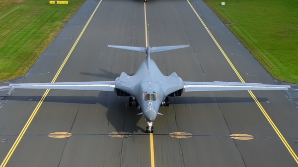 A U.S. Air Force Airman, assigned to the 345th Expeditionary Bomb Squadron, stands a B-1B Lancer during a Bomber Task Force Europe mission at Ørland Air Base, Norway, Aug. 21, 2025. BTF missions expose and familiarize aircrew with air bases and operations in different geographic combatant command areas of operations to enable strategic access and integration with coalition forces to deter global conflict. (U.S. Air Force photo by Staff Sgt. Tambri Cason)