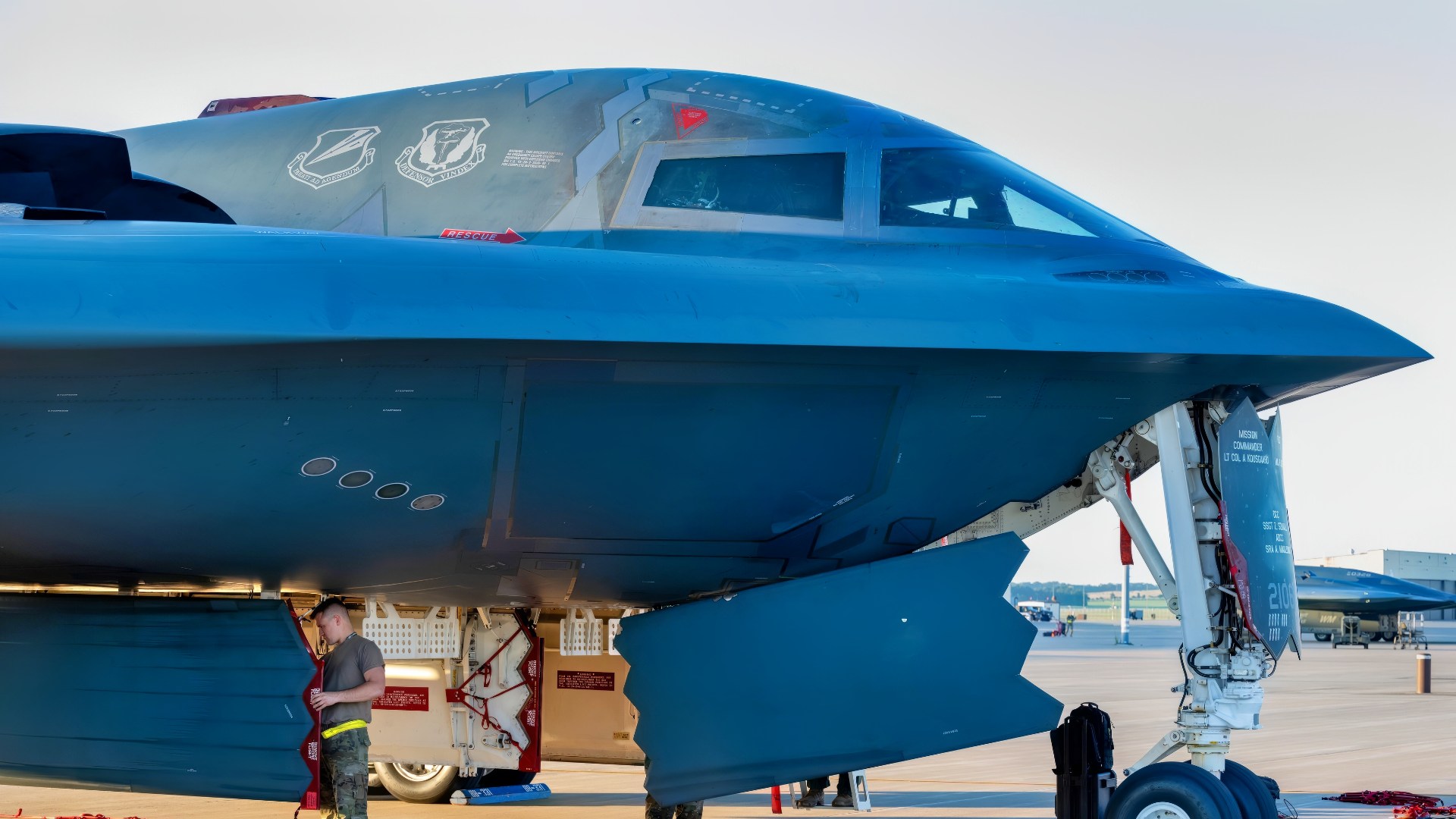 U.S. Airmen from the 393d Bomber Generation Squadron inspect and secure protective covering on the B-2 Spirit stealth bomber at Whiteman Air Force Base, Mo., July 25, 2024. Crew chiefs directly support the B-2 by inspecting and maintaining it daily to ensure its mission ready at a moment's notice. (U.S. Air Force photo by Airman 1st Class Bryce Moore)