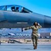 U.S. Air Force Senior Airman Marydith Stidham, a 125th Aircraft Maintenance Squadron crew chief, marshals Capt. Steven Fleming, a 125th Fighter Squadron F-15C Eagle pilot, while taxiing on the flightline at Nellis Air Force Base, Nevada, April 16, 2024. Units assigned to the 125th Fighter Wing participated a two-week exercise in support of the USAF Weapons School. During the exercise, the wing operated in both daytime and nighttime vulnerability periods in a contested degraded environment, preparing students for real-world conditions. (U.S. Air Force photo by Senior Airman Jose Miguel T. Tamondong)