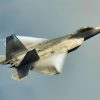 A U.S. Air Force F-22A Raptor aircraft assigned to the 27th Expeditionary Fighter Squadron flies above the guided missile destroyer USS Preble (DDG 88), not pictured, during an air defense exercise in the Philippine Sea Sept. 24, 2013. The Preble was part of the George Washington Carrier Strike Group and was underway in the U.S. 7th Fleet area of responsibility supporting maritime security operations and theater security cooperation efforts. (U.S. Navy photo by Mass Communication Specialist 3rd Class Paul Kelly/Released)