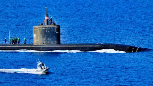 A harbor security boat escorts the attack submarine USS Annapolis (SSN 760) as the ship departs Souda Bay, Crete, following a port visit on March 20, 2010. DoD photo by Paul Farley, U.S. Navy. (Released)