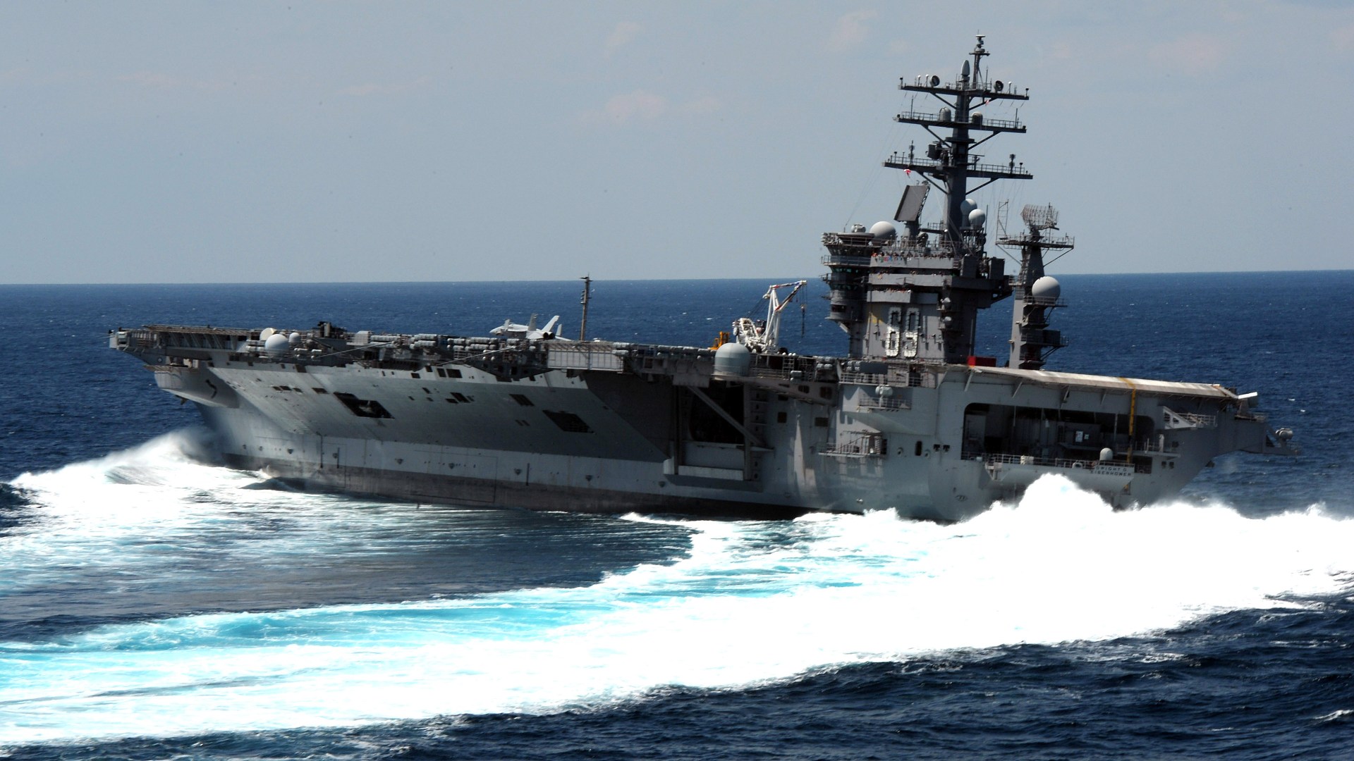 The Nimitz-class aircraft carrier USS Dwight D. Eisenhower conducts rudder turns during sea trials. Dwight D. Eisenhower completed a nine-month planned incremental availability at Norfolk Naval Ship Yard on June 10, 2011.