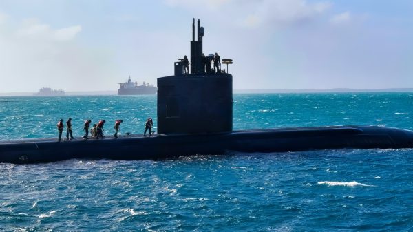 DIEGO GARCIA, British Indian Ocean Territory (Aug. 21, 2020) – USS Greeneville (SSN 772) enters Diego Garcia’s harbor Aug. 21, 2020. Sailors assigned to U.S. Navy Support Facility (NSF) Diego Garcia provided mail delivery and trash disposal for Greeneville. NSF Diego Garcia provides logistic, service, recreational and administrative support to U.S. and Allied Forces forward deployed to the Indian Ocean and Arabian Gulf. U.S. Navy Photos by Mass Communication Specialist Seaman Michael T. Porterfield. (Released)