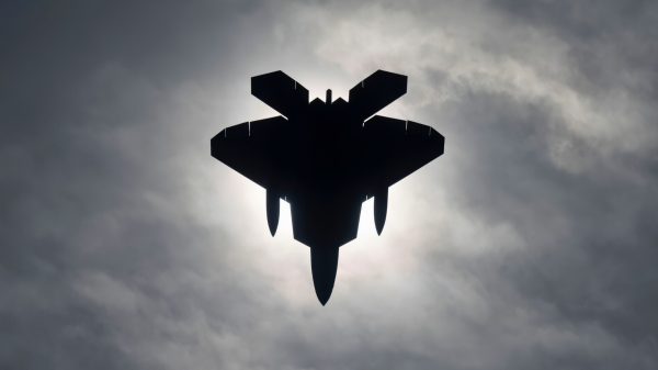 DAYTON, Oh.--An F-22A Raptor from the 1st Fighter Wing conducts flying operations during a solar eclipse, April 8, 2024. The aircraft is from the 27th Fighter Squadron stationed at Joint Base Langley-Eustis, Va. The squadron was conducting dissimilar formation training in unfamiliar airspace.(U.S. Air Force Tech. Sgt. Matthew Coleman-Foster)