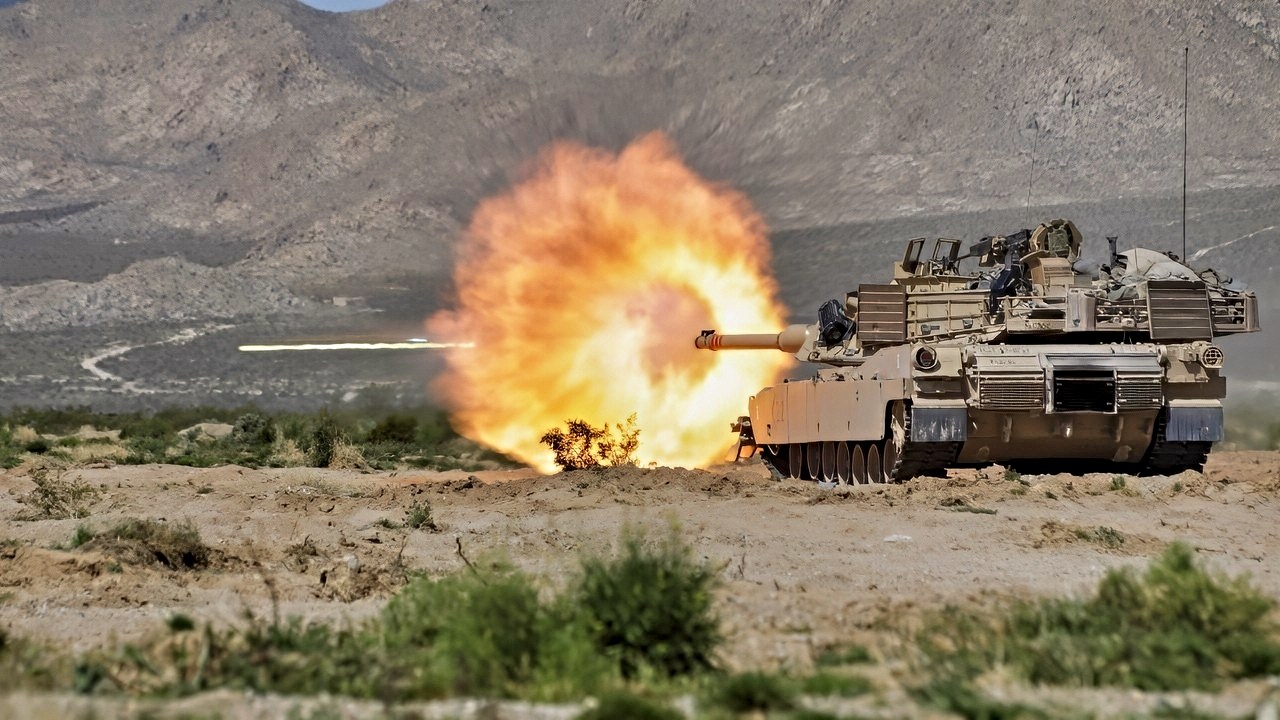 U.S. Soldiers assigned to 3rd Battalion, 8th Cavalry Regiment, 3rd Armored Brigade Combat Team, 1st Cavalry Division fire an M1 Abrams at enemy targets during Rotation 24-06, at the National Training Center, Fort Irwin, Calif., April 11, 2024. Rotations at the National Training Center ensure Army Brigade Combat Teams remain versatile, responsive, and consistently available for current and future contingencies. (U.S. Army photo by Staff Sgt. Julie Jaeger, Operations Group, National Training Center)
