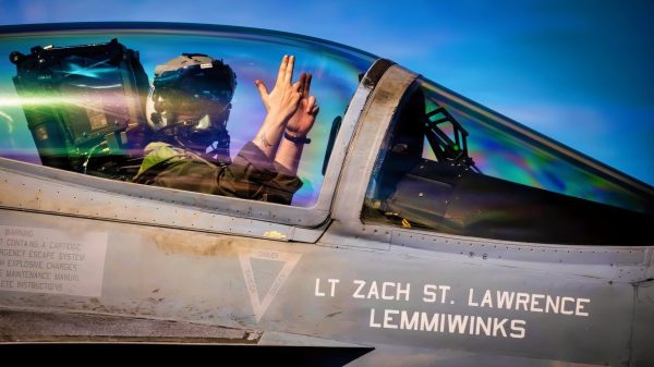A U.S. Sailor assigned to Strike Fighter Squadron 37 signals to arm ordnance in an F/A-18E Super Hornet aircraft on the flight deck of the world’s largest aircraft carrier, Ford-class aircraft carrier USS Gerald R. Ford (CVN 78), while underway in the Caribbean Sea, Nov. 30, 2025. U.S. military forces are deployed to the U.S. Southern Command area of responsibility in support of Operation SOUTHERN SPEAR, Department of War-directed operations, and the president's priorities to disrupt illicit drug trafficking and protect the homeland. (U.S. Navy photo)