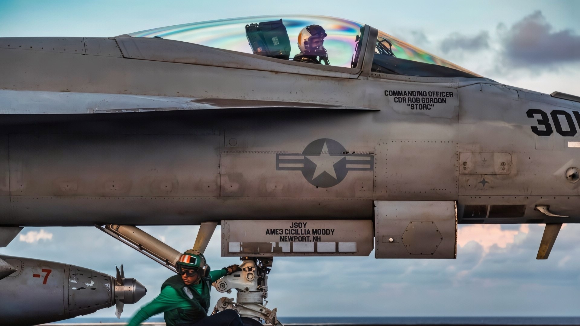 A U.S. Sailor prepares an F/A-18F Super Hornet aircraft for launch from the flight deck of the world's largest aircraft carrier, Ford-class aircraft carrier USS Gerald R. Ford (CVN 78), while underway in the Caribbean Sea, Nov. 25, 2025. U.S. military forces are deployed to the Caribbean in support of the U.S. Southern Command mission, Department of War-directed operations, and the president’s priorities to disrupt illicit drug trafficking and protect the homeland. (U.S. Navy photo)